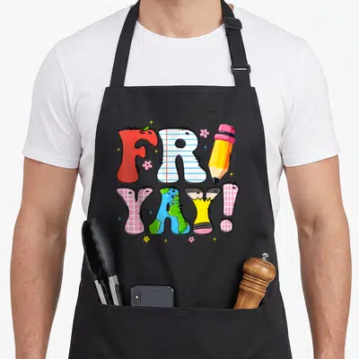 Trip teacher apron - FRI YAY! text art with pencil, earth globe, flowers, and sparkles in cartoon style — shown on a black cotton canvas apron against a white background