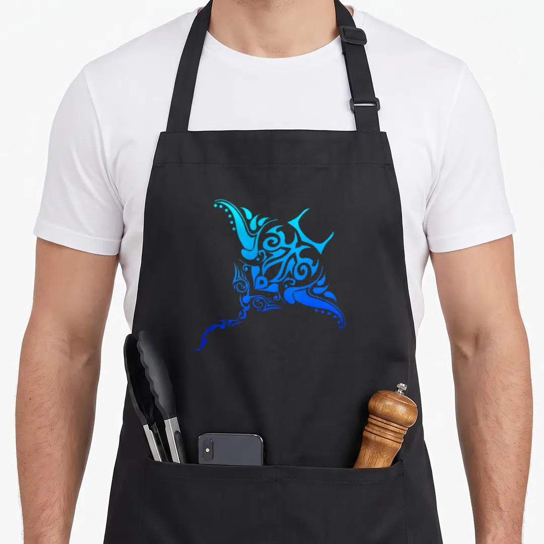 Hawaiian tattoo apron - Stylized stingray with cyan to blue gradient and ornate swirls in line-art style — shown on a black cotton canvas apron against a white background