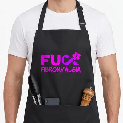 Fibromyalgia chronic fatigue awareness apron - Magenta FUC FIBROMYALGIA text with purple ribbon-K and flower graphic — shown on a black cotton canvas apron against a white background