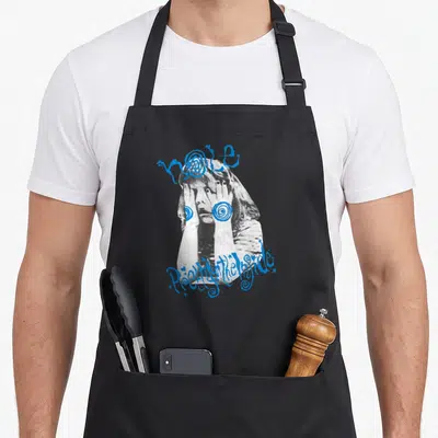 Hole pretty apron - Distressed B&W photo of person with hands on face overlaid with blue spirals and text hole Pretty — shown on a black cotton canvas apron against a white background