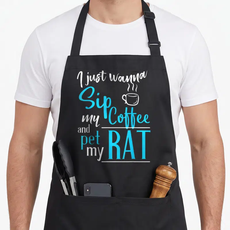 Rat coffee apron - I just wanna Sip Coffee and pet my RAT text with steaming cup icon in blue and white — shown on a black cotton canvas apron against a white background
