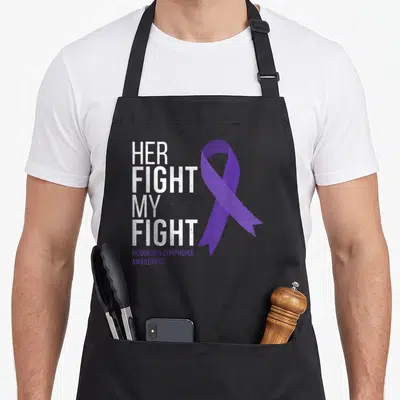 Hodgkin warrior lymphoma awareness apron - Her Fight My Fight text and purple ribbon for Hodgkin's Lymphoma Awareness — shown on a black cotton canvas apron against a white background