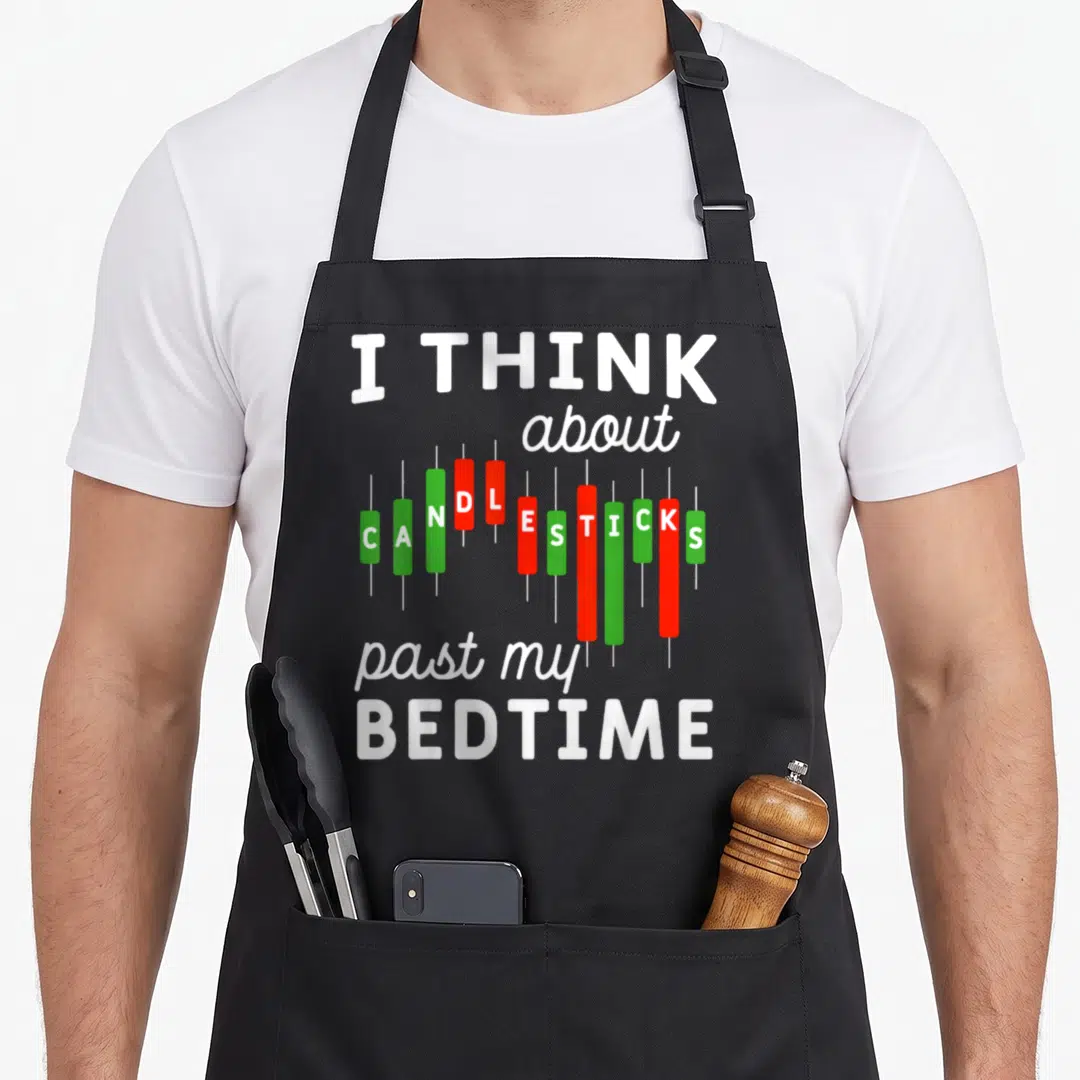 Candle stock aprons - I THINK about CANDLESTICKS past my BEDTIME text with red and green chart bars — shown on a black cotton canvas apron against a white background