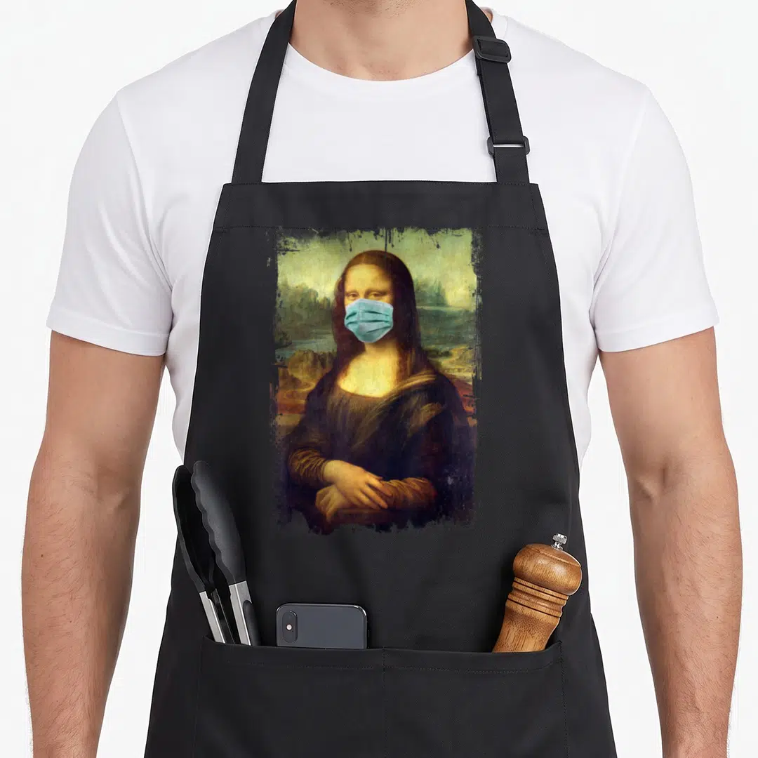 Mona famous aprons - Realistic portrait of Mona Lisa wearing blue surgical mask against landscape background — shown on a black cotton canvas apron against a white background