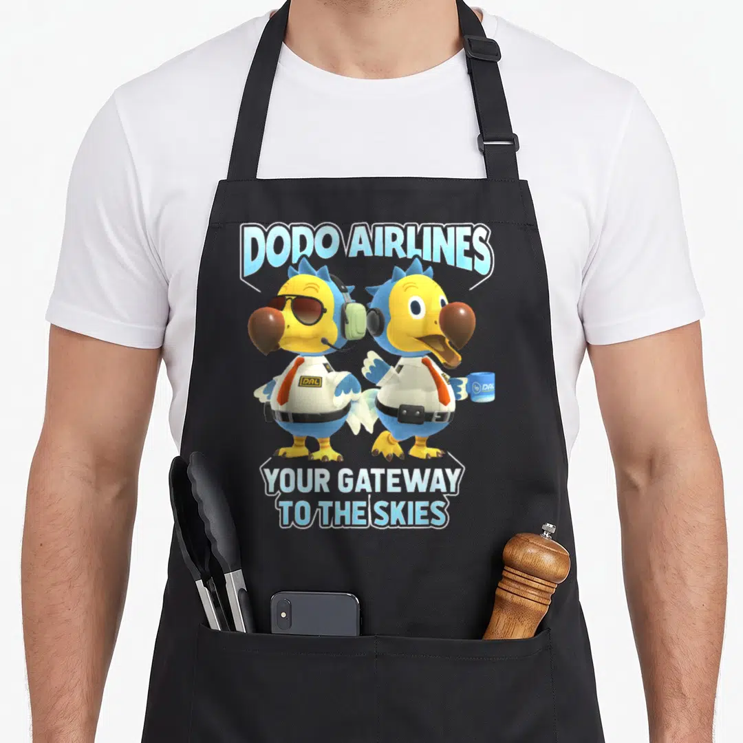 Horizon animal apron - Two cartoon dodo birds in pilot uniforms with Dodo Airlines text and blue yellow orange colors — shown on a black cotton canvas apron against a white background