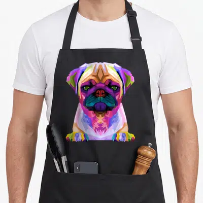 Pop dog apron - Colorful geometric pug portrait in purple, blue, pink, orange, and yellow cartoon style — shown on a black cotton canvas apron against a white background