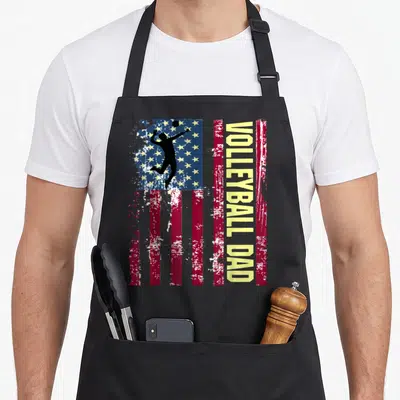 Funny volleyball american flag apron - Vertical distressed US flag with black volleyball player silhouette and yellow — shown on a black cotton canvas apron against a white background