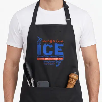 Frozen harvesting apron - Blue and orange Kristoff & Sven's Ice logo with snowman and reindeer head illustration — shown on a black cotton canvas apron against a white background