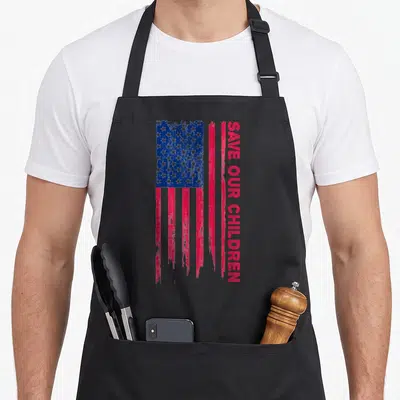 Save human trafficking awareness apron - Distressed USA flag in red white blue next to vertical SAVE OUR CHILDREN text — shown on a black cotton canvas apron against a white background