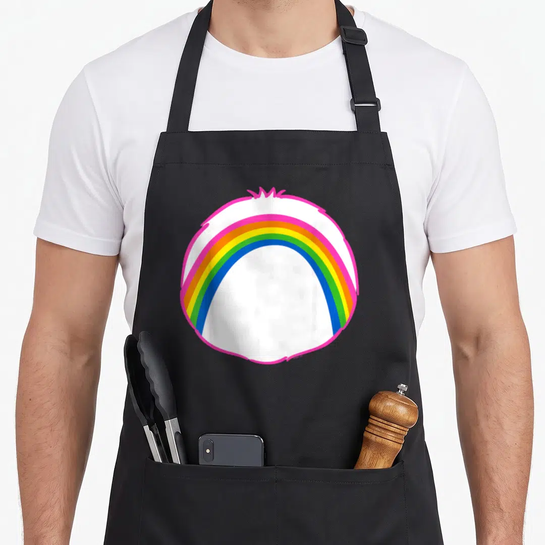 Cheer halloween apron - Rainbow arc in pink orange yellow green blue inside pink circle on black — shown on a black cotton canvas apron against a white background