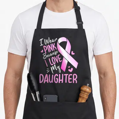 Funny daughter breast cancer awareness aprons - Pink ribbon with I Wear PINK Because I LOVE My DAUGHTER text and small — shown on a black cotton canvas apron against a white background