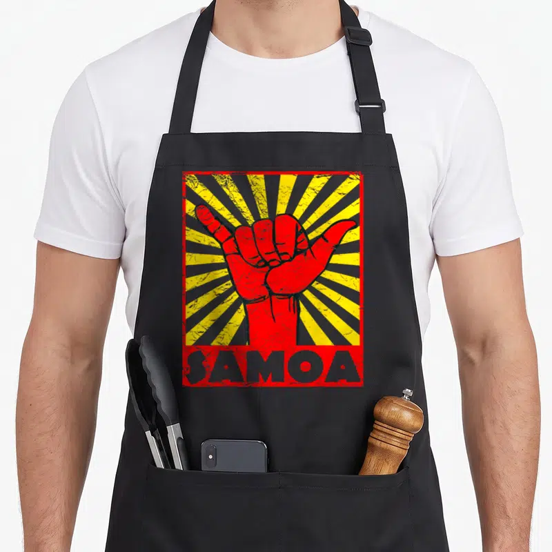 Beach samoa apron - Red shaka hand on yellow grey sunburst with SAMOA text in distressed style — shown on a black cotton canvas apron against a white background
