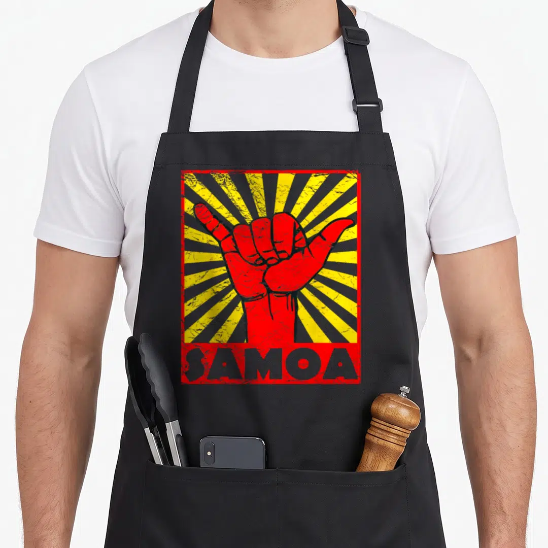 Beach samoa apron - Red shaka hand on yellow grey sunburst with SAMOA text in distressed style — shown on a black cotton canvas apron against a white background