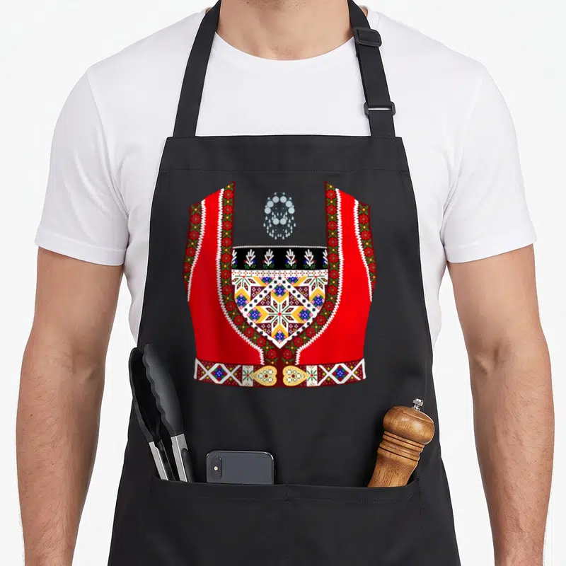Bunad scandinavian aprons - Red traditional vest with silver necklace and colorful geometric embroidery on a plain — shown on a black cotton canvas apron against a white background