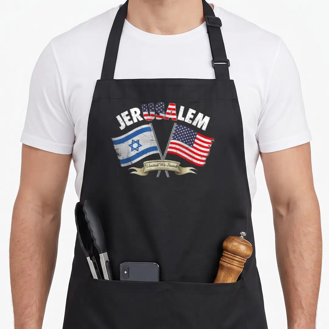 Stand jerusalem apron - JERUSALEM text with crossed Israeli and USA flags and United We Stand ribbon in distressed red — shown on a black cotton canvas apron against a white background