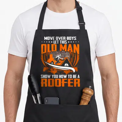 Move roofer apron - Roofer on orange roof with brick wall, surrounded by bold orange and white text reading Move — shown on a black cotton canvas apron against a white background