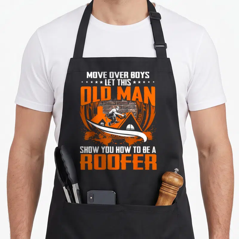 Move roofer apron - Roofer on orange roof with brick wall, surrounded by bold orange and white text reading Move — shown on a black cotton canvas apron against a white background