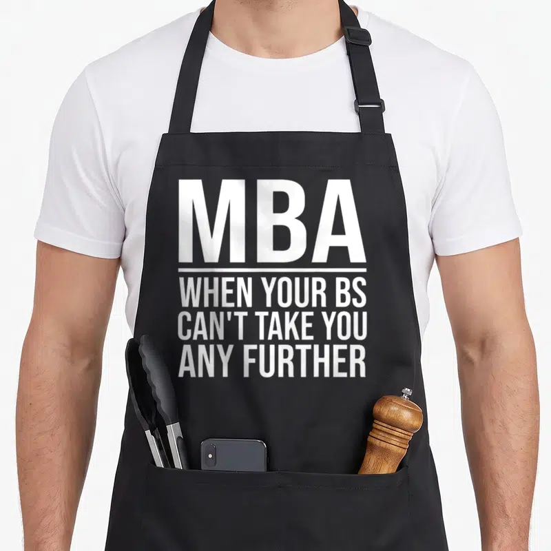 Degree graduation master apron - White stacked text MBA when your BS cant take you any further separated by horizontal — shown on a black cotton canvas apron against a white background