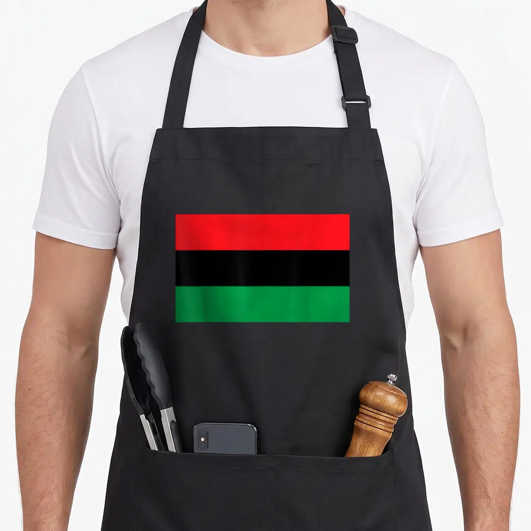 Unia african apron - Red black and green horizontal flag stripes on canvas apron — shown on a black cotton canvas apron against a white background