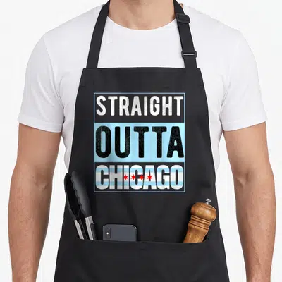 Chitown chicago apron - Stacked text straight outta chicago with bottom word filled in city flag pattern of blue white — shown on a black cotton canvas apron against a white background