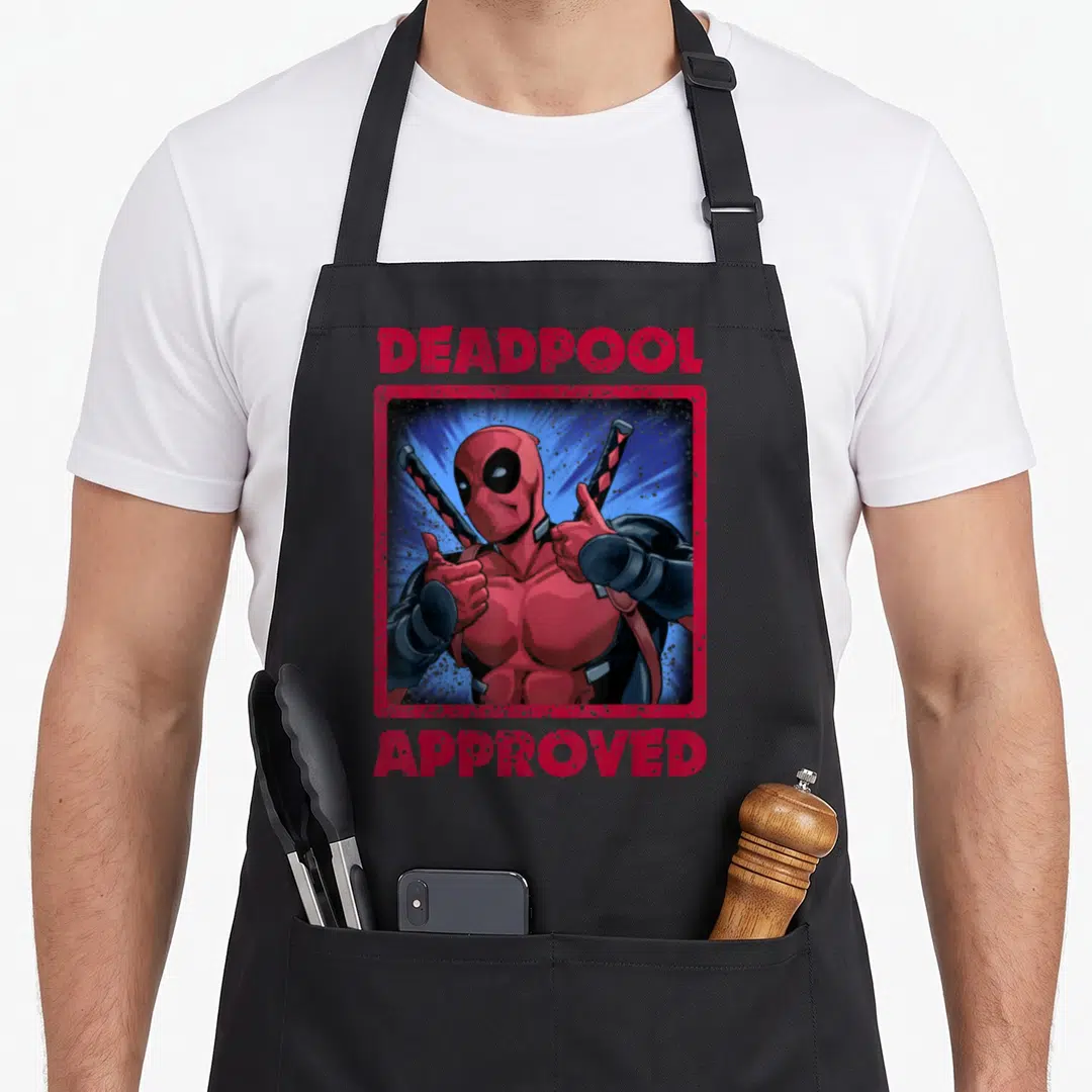 Thumb fan lover apron - Deadpool giving two thumbs up inside red distressed frame with approved text — shown on a black cotton canvas apron against a white background