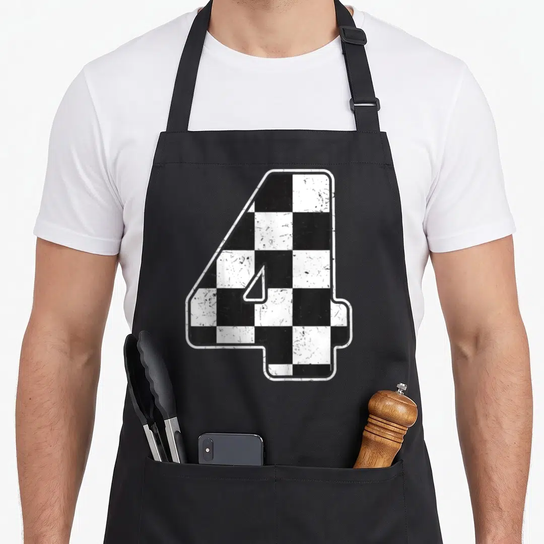 Four race car apron - Number 4 filled with black and white checkered pattern with distressed texture — shown on a black cotton canvas apron against a white background