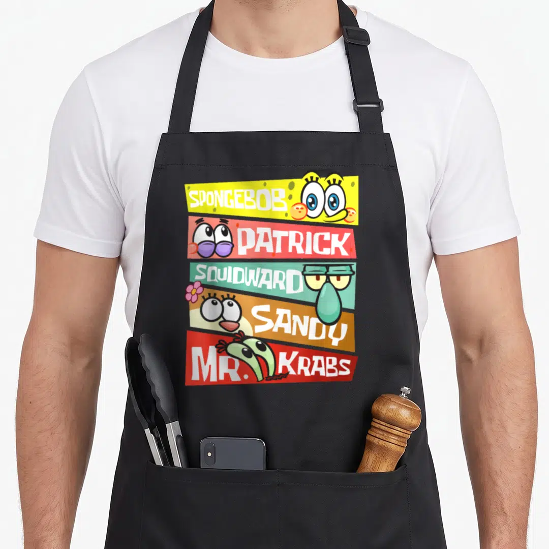 Patrick mr apron - Five colored banners with SpongeBob, Patrick, Squidward, Sandy, Mr. Krabs names and cartoon eyes — shown on a black cotton canvas apron against a white background