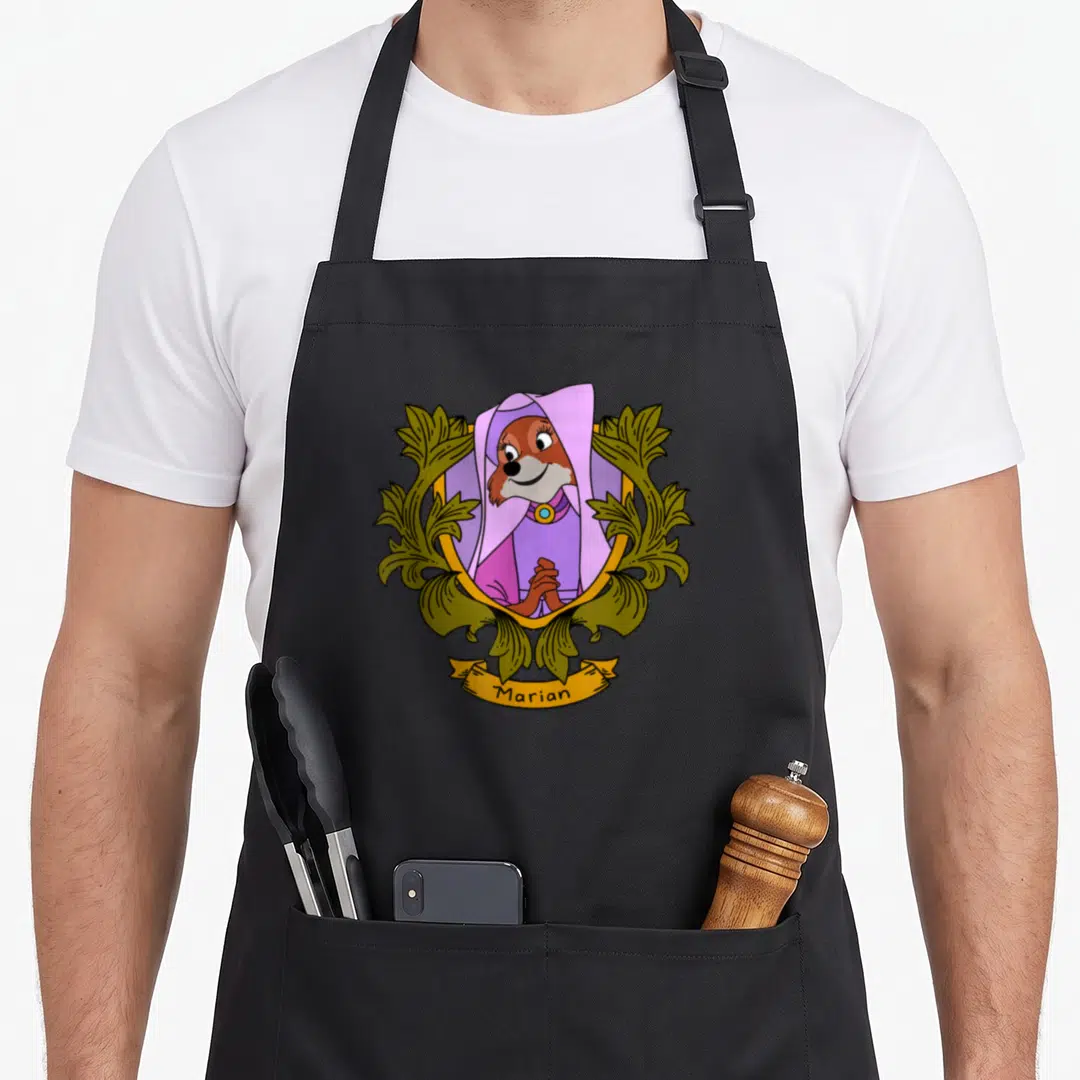 Robin floral apron - Cartoon fox in purple hood inside gold frame with green leaves and Marian banner — shown on a black cotton canvas apron against a white background