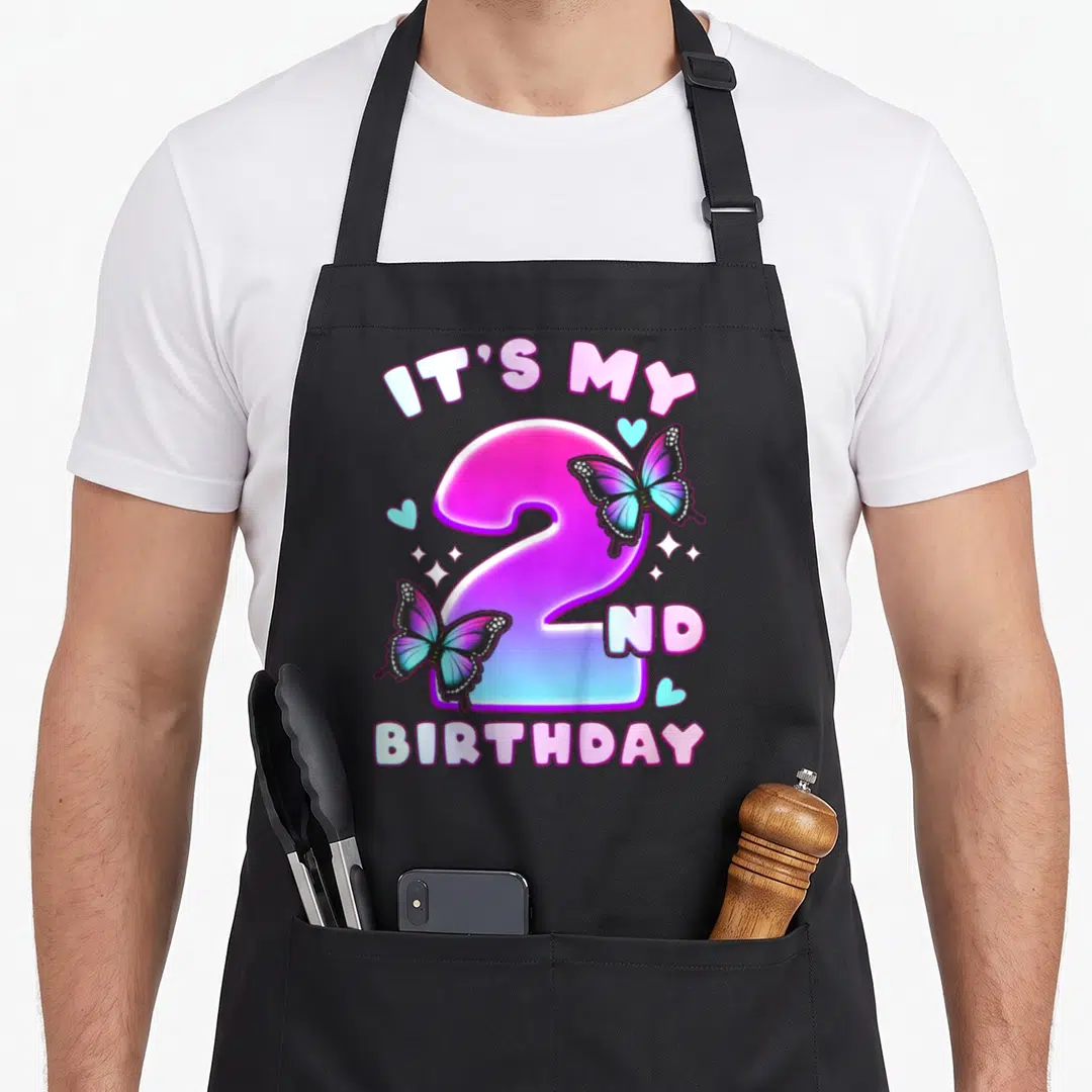 2nd butterfly aprons - Number 2 with IT'S MY 2ND BIRTHDAY text, butterflies, hearts, and sparkles in pink purple blue — shown on a black cotton canvas apron against a white background