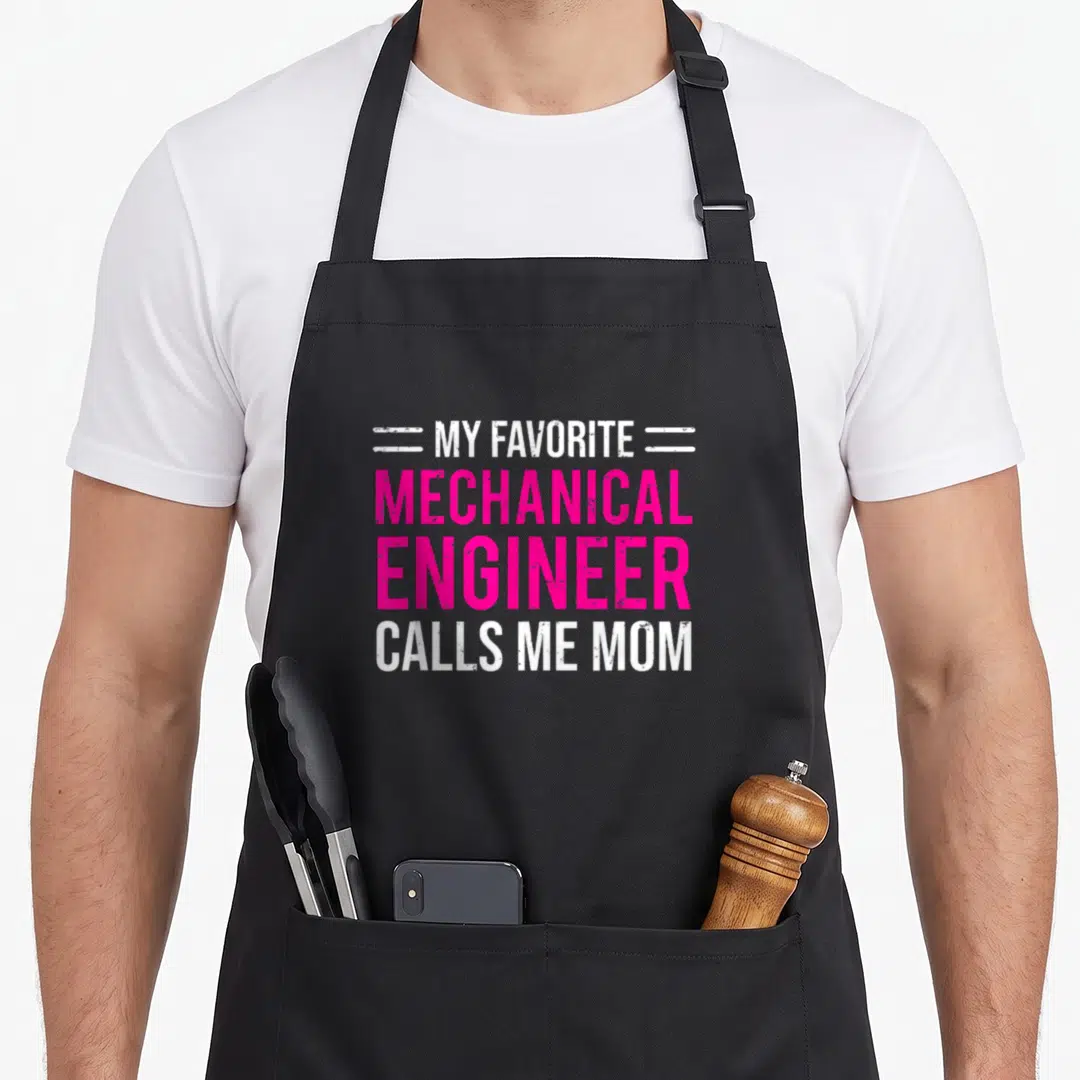 Call mechanical engineer apron - Pink and white stacked text reading my favorite mechanical engineer calls me mom — shown on a black cotton canvas apron against a white background