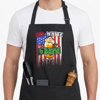 Brew craft 4th of july apron - Red White and Brew text over distressed flag with beer glass, wheat, and sausage — shown on a black cotton canvas apron against a white background