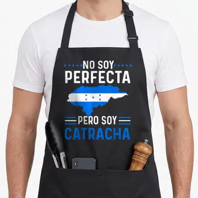 Perfecta honduran boy apron - No Soy Perfecta Pero Soy Catracha text flanking a Honduras map filled with blue and white — shown on a black cotton canvas apron against a white background