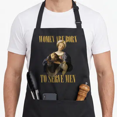 Christian to serve man apron - Classical woman holding severed head on platter between yellow text WOMEN ARE BORN — shown on a black cotton canvas apron against a white background