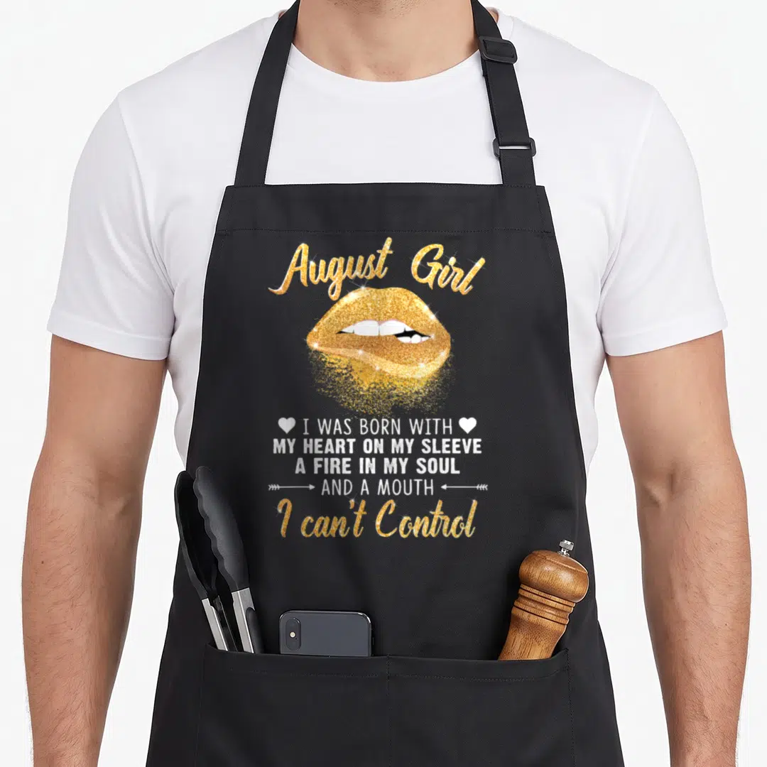Slay birthday apron - Gold glitter lips and August Girl text with white slogan and hearts — shown on a black cotton canvas apron against a white background