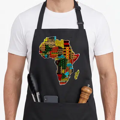Traditional african apron - Map of Africa filled with yellow red green blue black geometric patterns — shown on a black cotton canvas apron against a white background