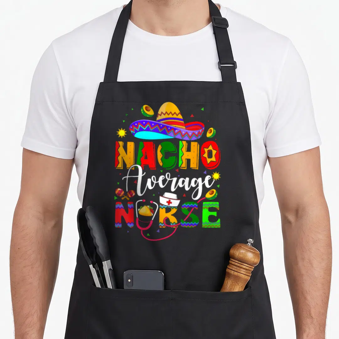 Nurse mexican apron - Colorful Nacho Average NURSE text with sombrero, stethoscope, avocados, and maracas in red yellow — shown on a black cotton canvas apron against a white background