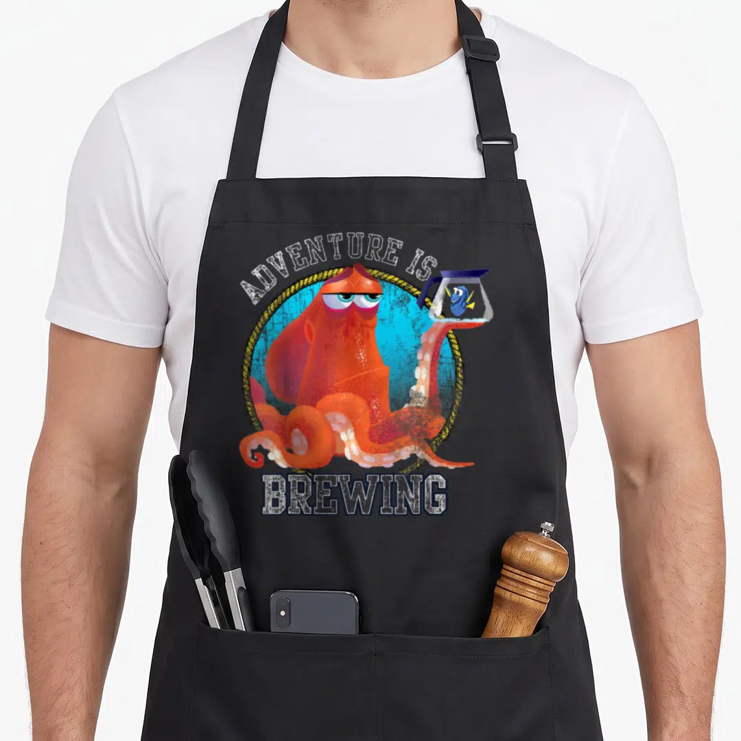 Finding brewing apron - Orange octopus holding fishbowl with blue fish inside rope circle under arched text — shown on a black cotton canvas apron against a white background