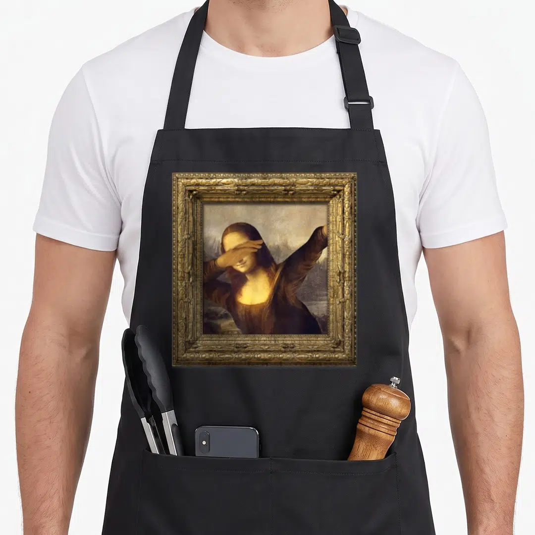 Funny dabbing mona lisa apron - Mona Lisa dabbing inside ornate gold frame, brown and tan photo style — shown on a black cotton canvas apron against a white background