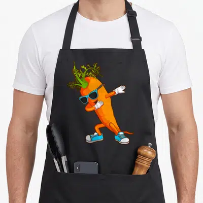 Dabbing vegetable apron - Orange cartoon carrot wearing blue sunglasses and white gloves in a dance pose — shown on a black cotton canvas apron against a white background