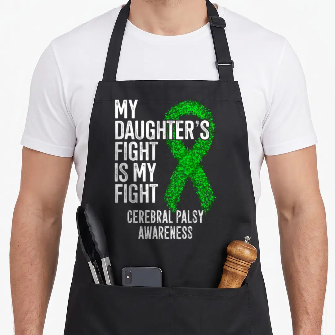 Daughter cerebral palsy awareness apron - Distressed white text My Daughter Fight Is My Fight next to speckled green — shown on a black cotton canvas apron against a white background