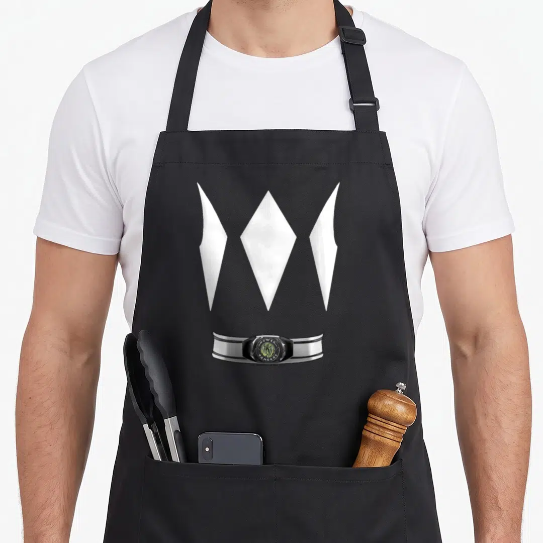 Costume halloween apron for grilling - Three white diamond shapes above a silver belt with green center emblem — shown on a black cotton canvas apron against a white background