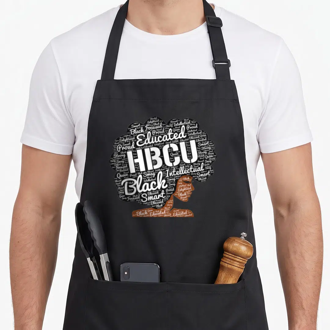 Hbcu hair apron - Word cloud head silhouette with HBCU educated smart strong text in black white brown — shown on a black cotton canvas apron against a white background