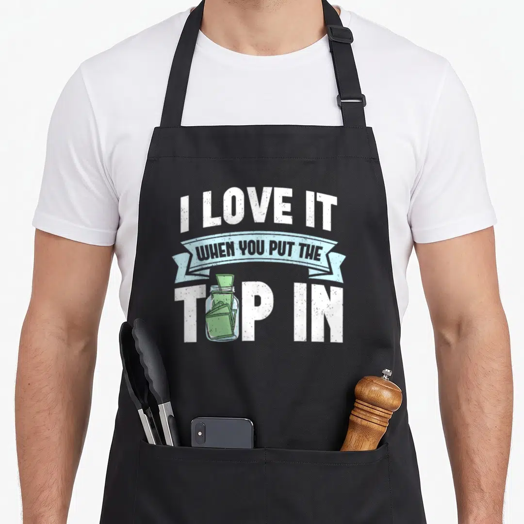 Mixologist bartender apron - I love it when you put the top in text with a green tip jar graphic — shown on a black cotton canvas apron against a white background