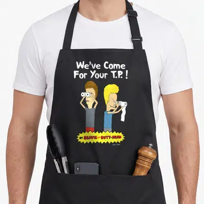 Come beaverton apron - Two cartoon men looking through toilet paper rolls under We've Come For Your T.P. ! text — shown on a black cotton canvas apron against a white background