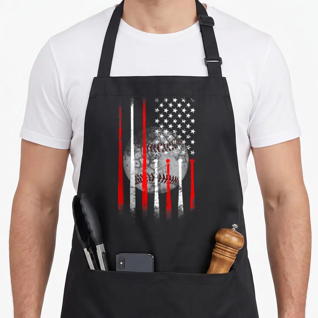 Funny baseball american flag apron - Distressed red and white baseball with flag stripes and stars — shown on a black cotton canvas apron against a white background