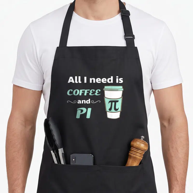 Math coffee apron - Stacked text All I need is COFFEE and PI next to mint green cup with pi symbol on sleeve — shown on a black cotton canvas apron against a white background
