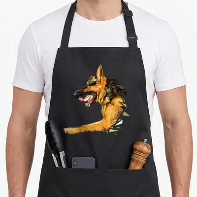 Funny shepherd dog mom apron - Low poly geometric German Shepherd head in tan brown and black polygons — shown on a black cotton canvas apron against a white background