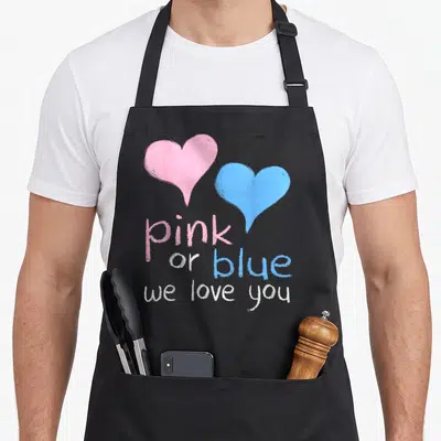 Shower apron or apron - Pink and blue hearts above pink or blue we love you text — shown on a black cotton canvas apron against a white background