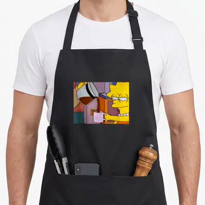 Lisa coffee apron - Cartoon Lisa Simpson holding pink mug while brown coffee pours from white pot — shown on a black cotton canvas apron against a white background