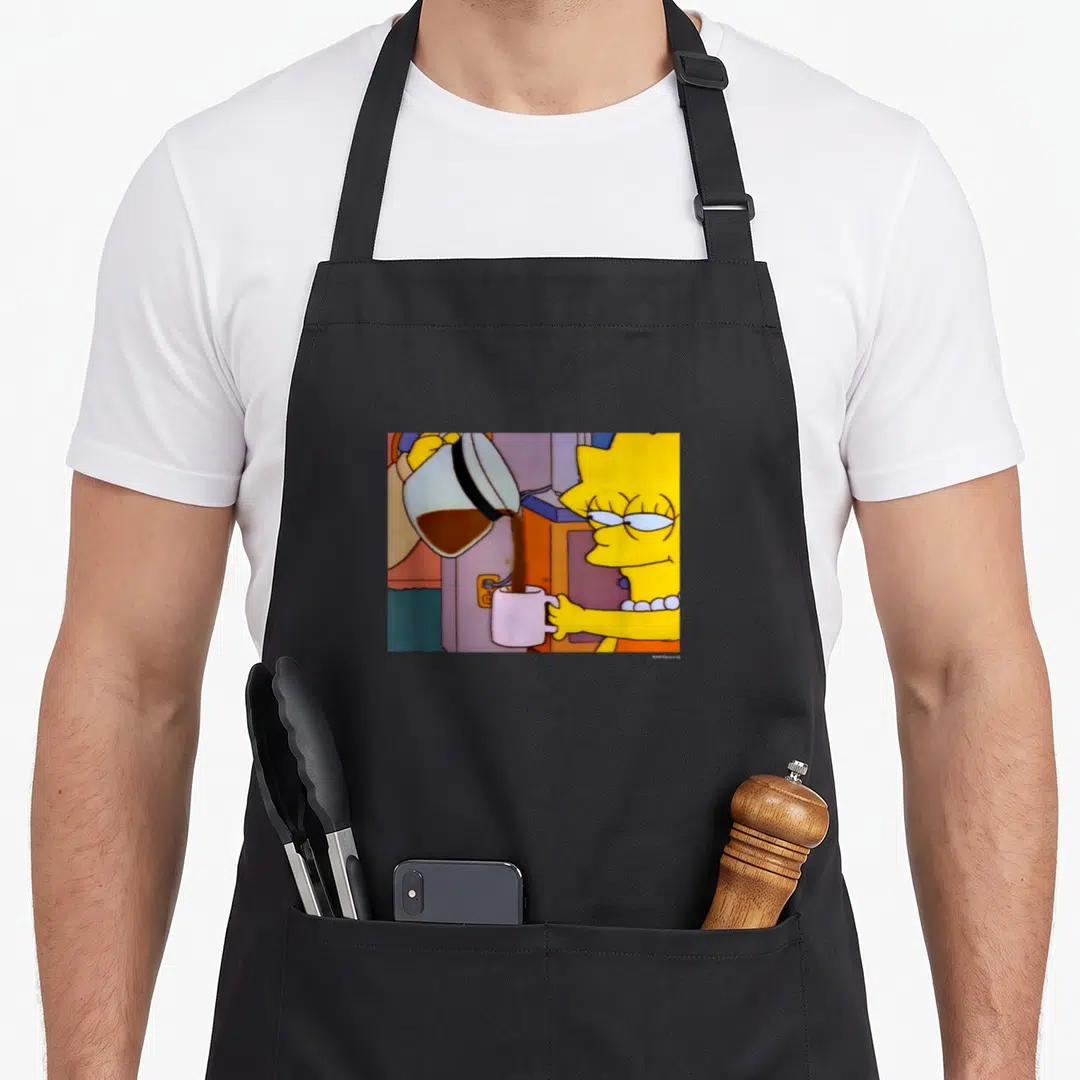 Lisa coffee apron - Cartoon Lisa Simpson holding pink mug while brown coffee pours from white pot — shown on a black cotton canvas apron against a white background